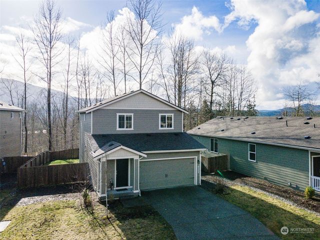 a front view of a house with a yard