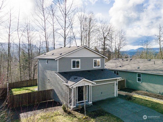 a view of a terrace with couches and sky view