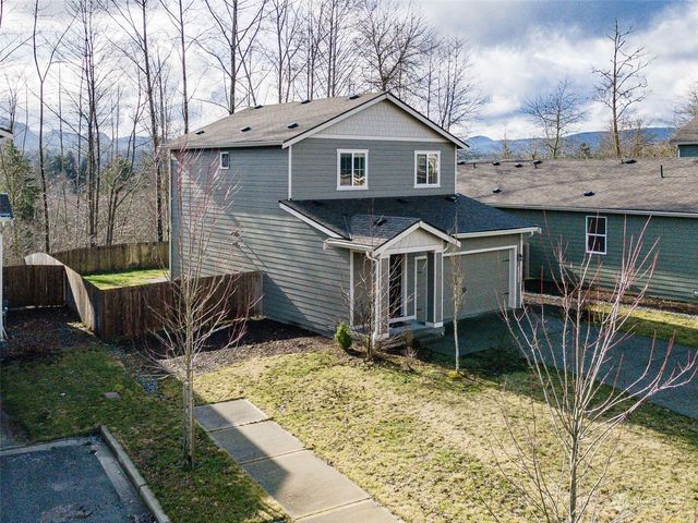 a backyard of a house with lots of green space
