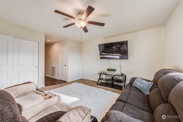 a kitchen with granite countertop a refrigerator stove and sink