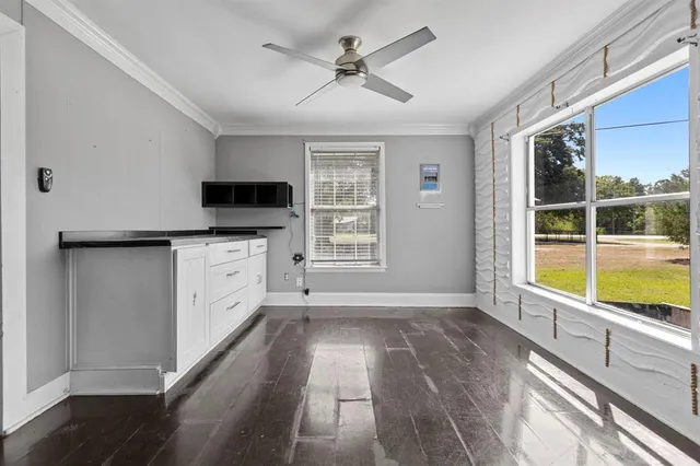 a view of a kitchen with a sink and a window