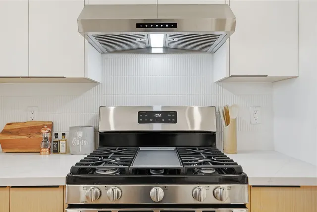 a bedroom with a large bed and a view of bathroom