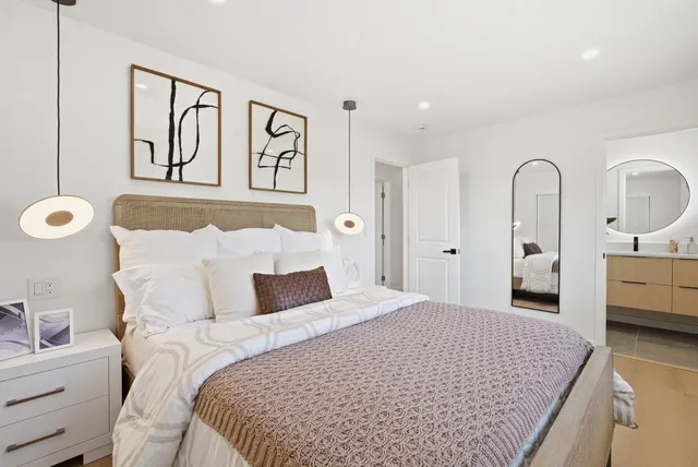 a bed room with furniture and a window