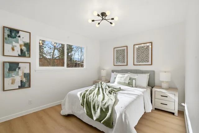 a view of a chairs and table in backyard