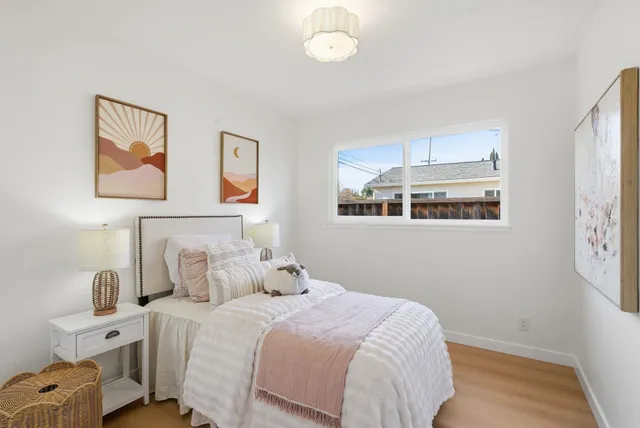 a view of a house with backyard porch and sitting area