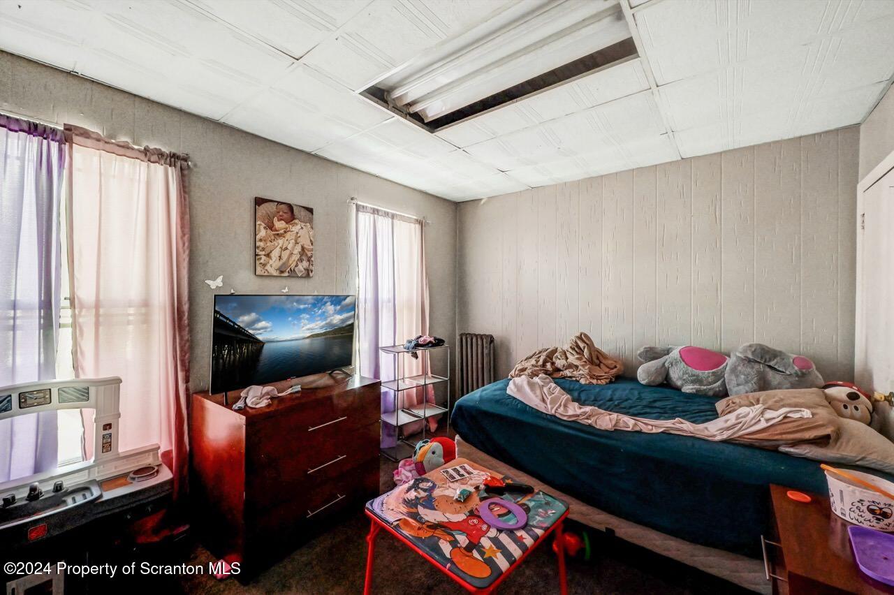 938 Providence Road Scranton, PA 18508 - Photo 15 of 22 a living room with furniture and a flat screen tv