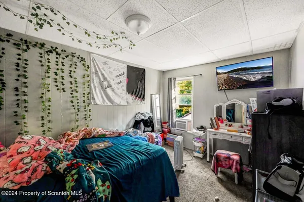 a bedroom with a bed and furniture