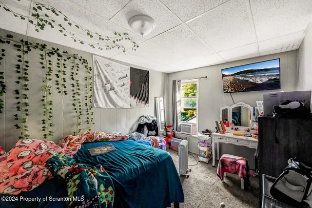 a bedroom with a bed and furniture