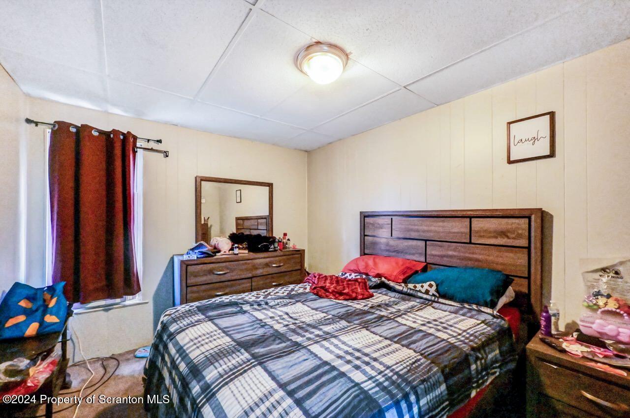 938 Providence Road Scranton, PA 18508 - Photo 19 of 22 a bedroom with a bed and furniture