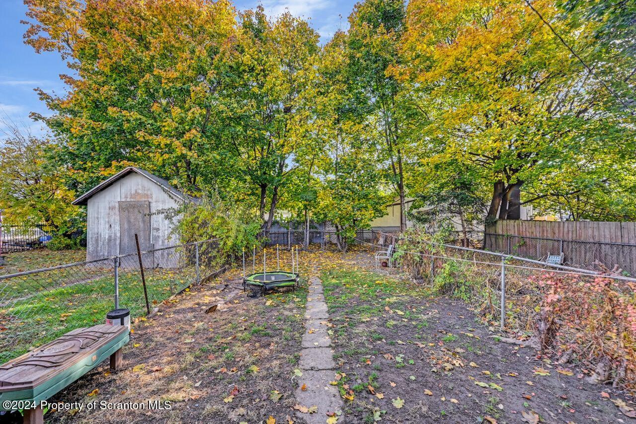 938 Providence Road Scranton, PA 18508 - Photo 22 of 22 a backyard of a house with table and chairs