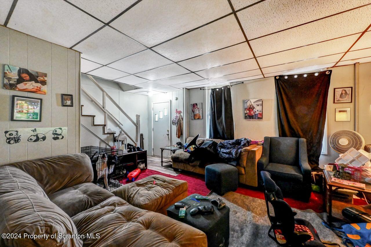 938 Providence Road Scranton, PA 18508 - Photo 4 of 22 a living room with furniture a flat screen tv and a window
