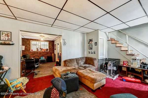 a living room with furniture a dining table and chairs with the view of living room
