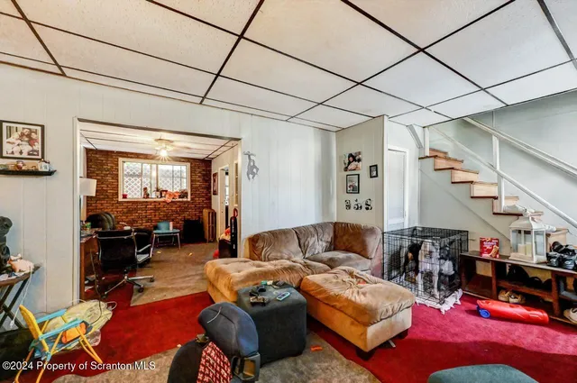 a living room with furniture a dining table and chairs with the view of living room
