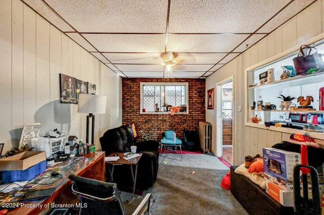 a room with furniture toys and a chandelier