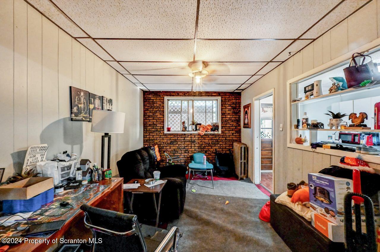 938 Providence Road Scranton, PA 18508 - Photo 7 of 22 a room with furniture toys and a chandelier