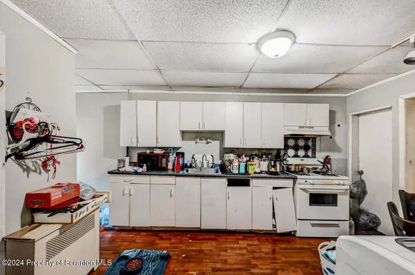 a kitchen with stainless steel appliances granite countertop a sink and cabinets