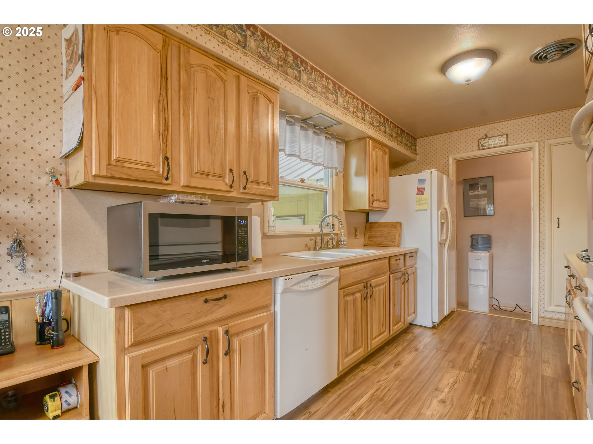 70930 Highway 207 Echo, OR 97826 - Photo 17 of 48 a kitchen with stainless steel appliances granite countertop a stove a sink and a microwave