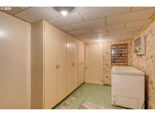 a living room with a couch and bookshelf