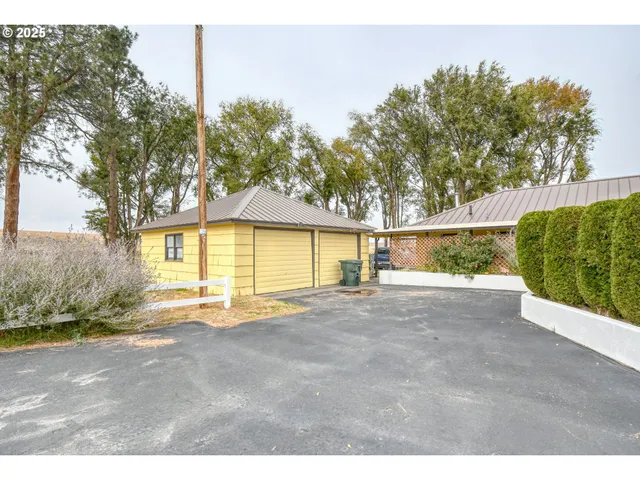a patio with a table and chairs