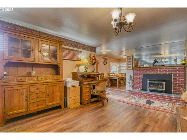 a living room with furniture a fireplace and a piano