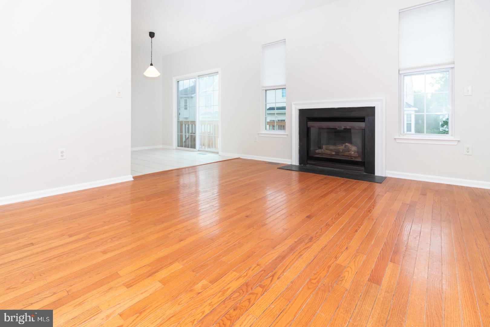 226 Hawthorne Way Riverside, NJ 08075 - Photo 7 of 32 a view of empty room with wooden floor and fireplace