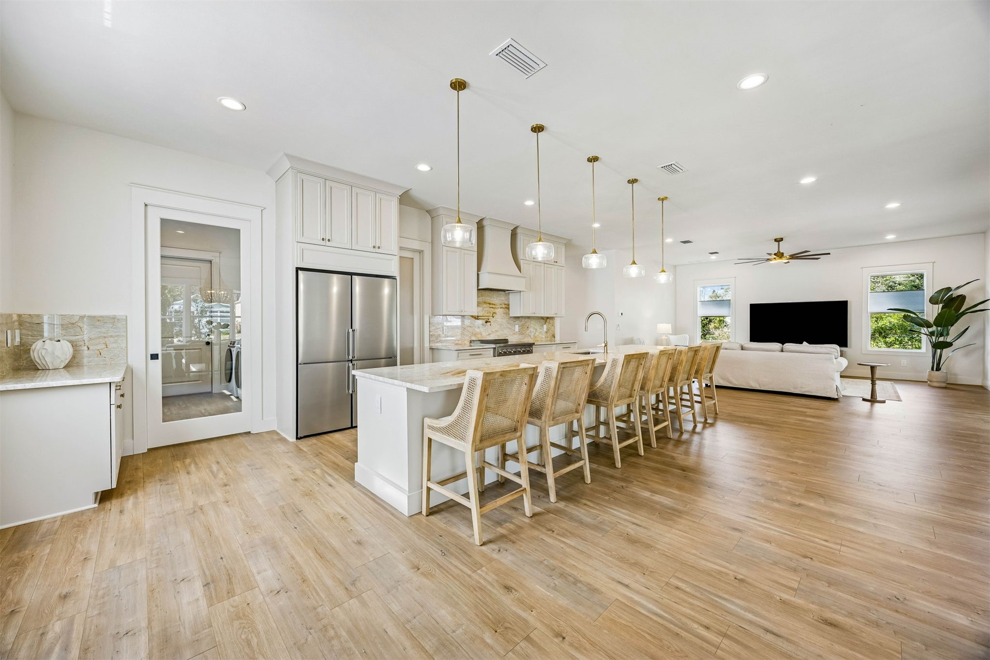 424 South 3rd Street Fernandina Beach, FL 32034 - Photo 4 of 38 a view of a dining room and livingroom with furniture wooden floor a chandelier