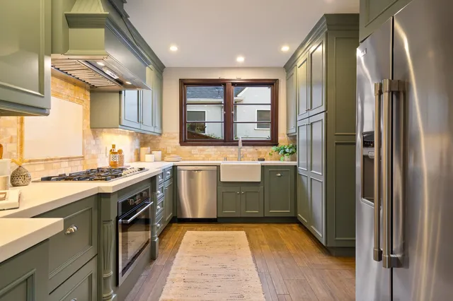 a kitchen with a stove and a sink