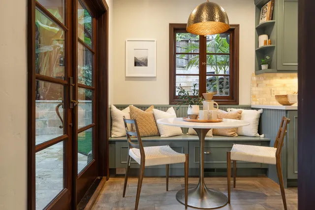 a view of a dining room with furniture window and outside view