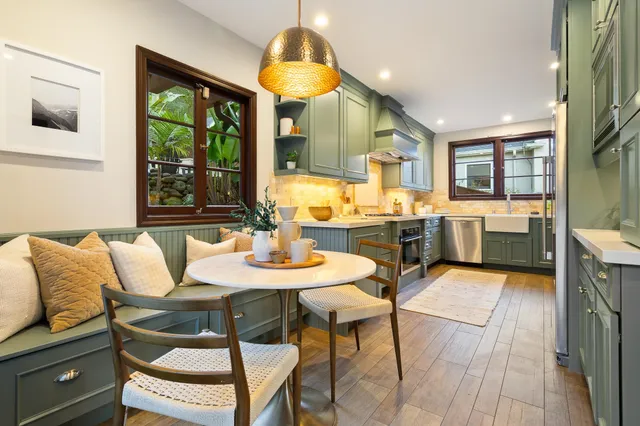 a kitchen with a table and chairs