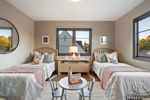 a bed room with a bed and a chair