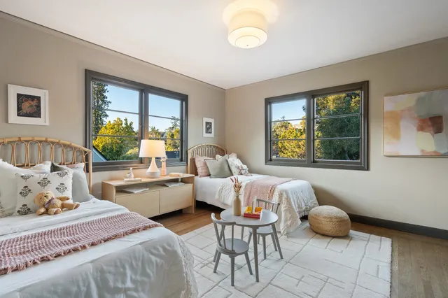 a bedroom with bed and a window