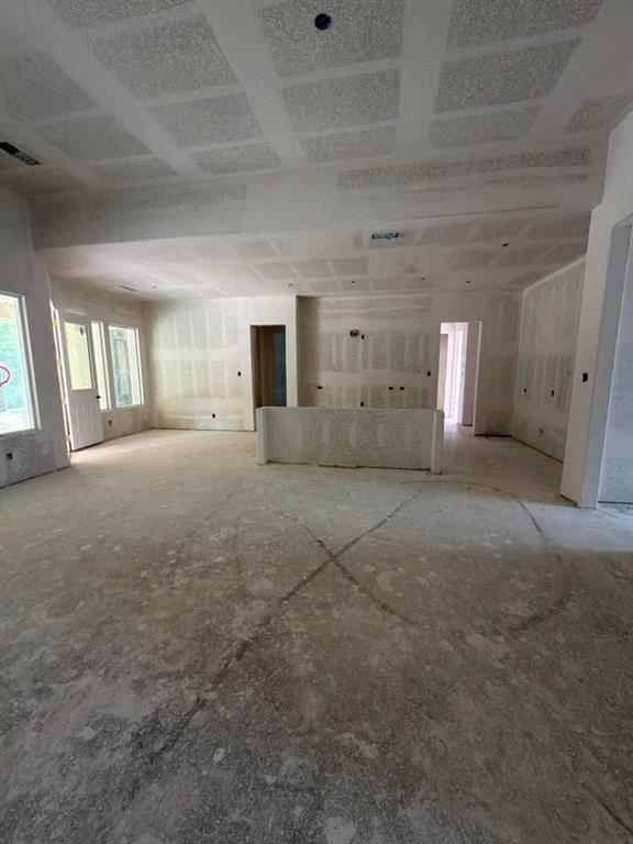 1003 Perrin Lane Van Alstyne, TX 75495 - Photo 10 of 18 a view of a empty room with a fireplace