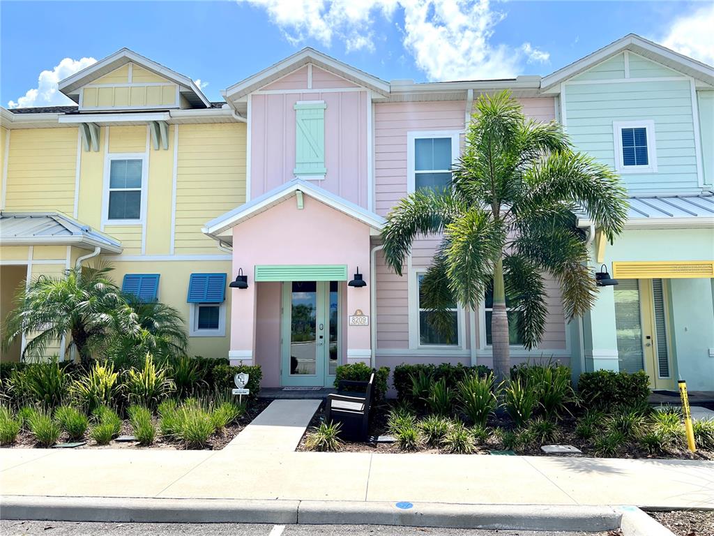8209 Surf Street Kissimmee, FL 34747 - Photo 1 of 74 a front view of a house with garden