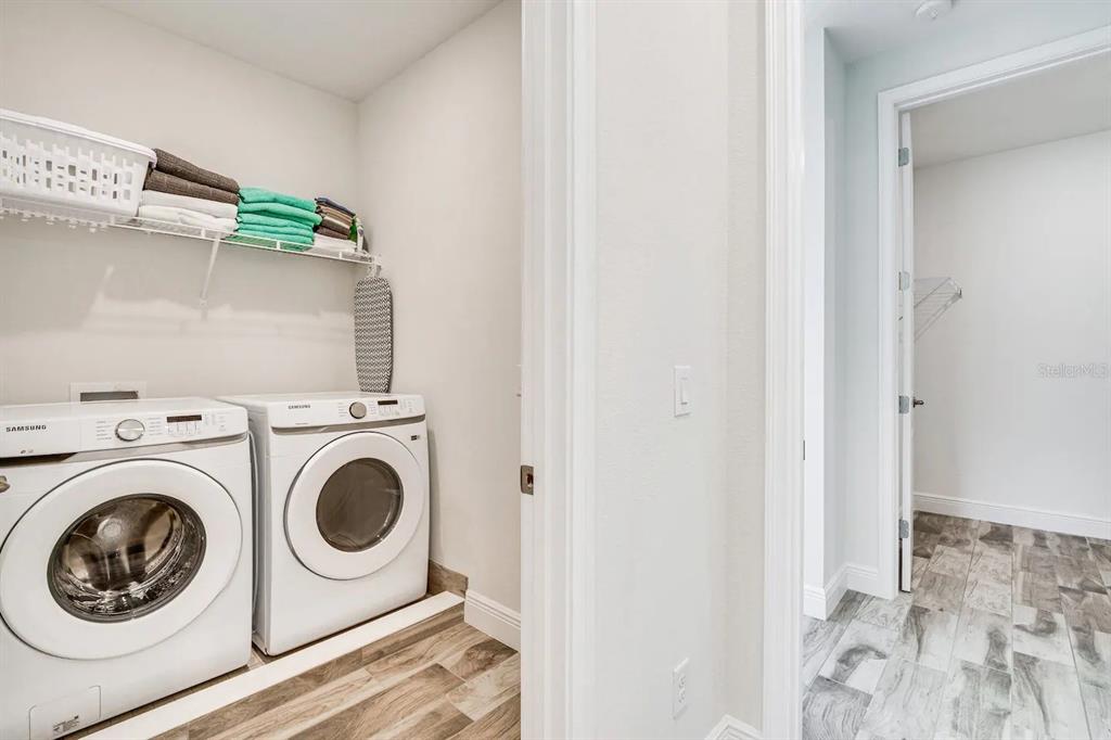 8209 Surf Street Kissimmee, FL 34747 - Photo 23 of 74 a utility room with dryer and washer