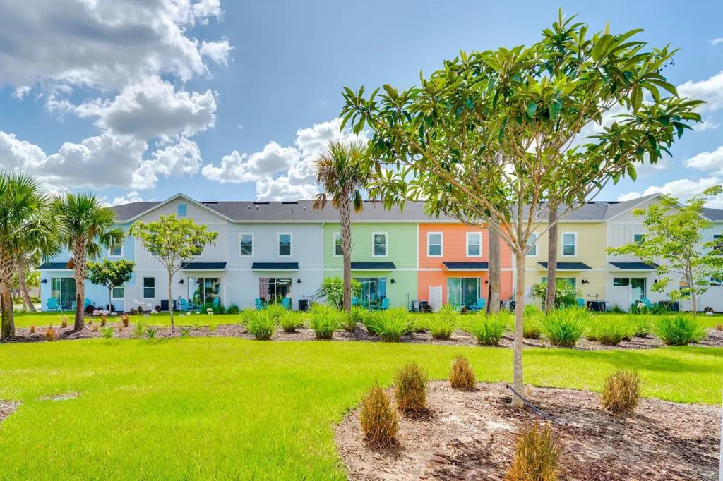 8209 Surf Street Kissimmee, FL 34747 - Photo 26 of 74 a front view of house with yard and green space