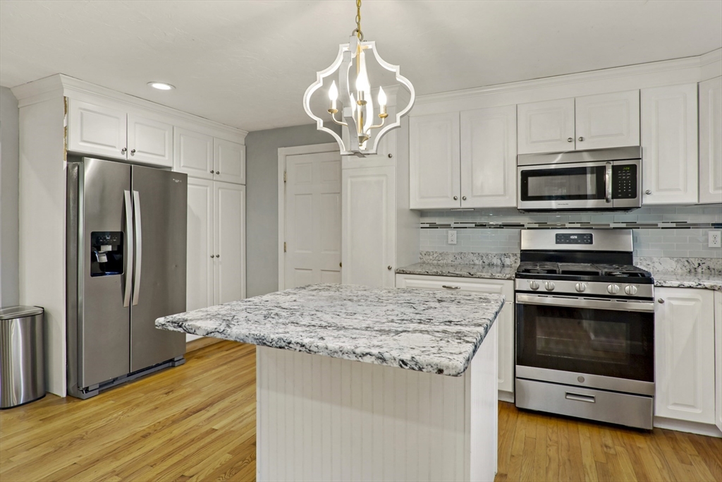 10 Briar Patch Lane Mashpee, MA 02649 - Photo 11 of 38 a kitchen with stainless steel appliances granite countertop a stove microwave and refrigerator