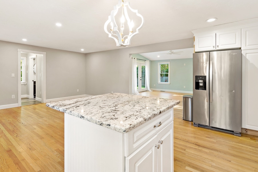 10 Briar Patch Lane Mashpee, MA 02649 - Photo 13 of 38 a kitchen with stainless steel appliances granite countertop hardwood floor sink and refrigerator