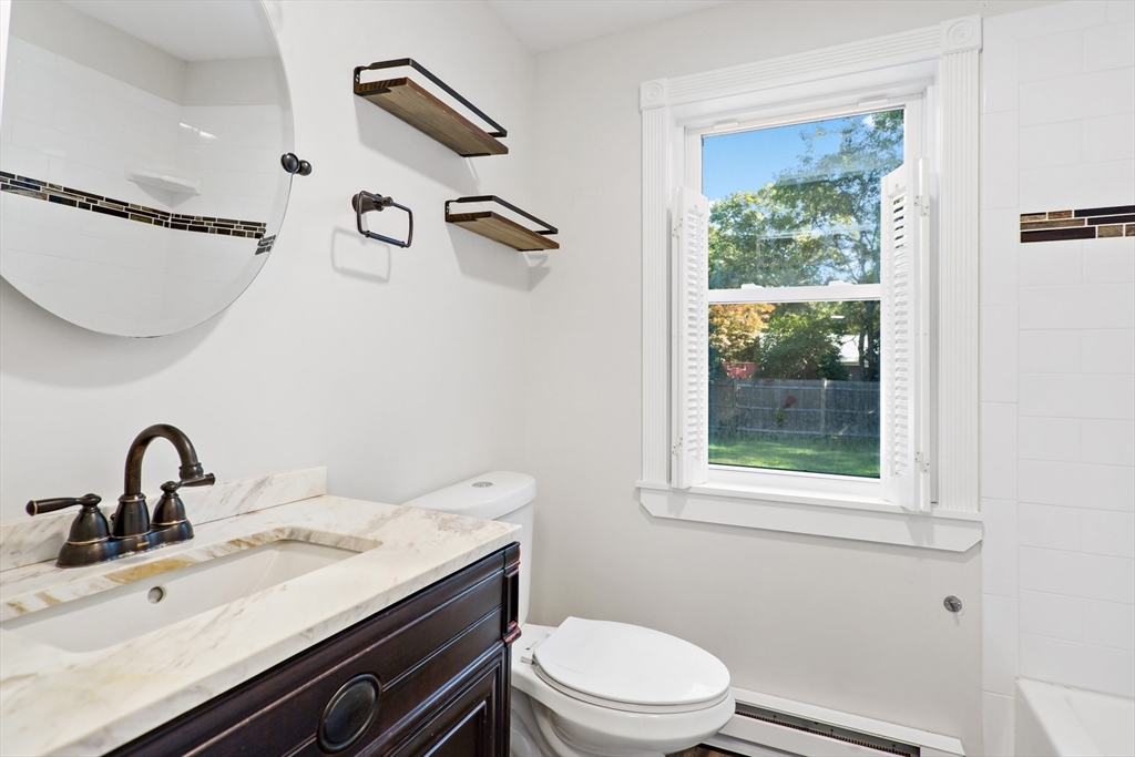 10 Briar Patch Lane Mashpee, MA 02649 - Photo 18 of 38 a bathroom with a sink a mirror and a toilet
