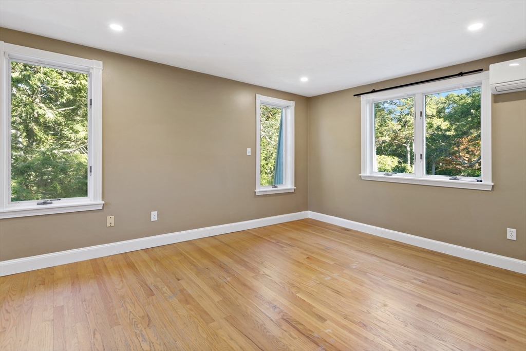 10 Briar Patch Lane Mashpee, MA 02649 - Photo 24 of 38 a view of an empty room with wooden floor and a window