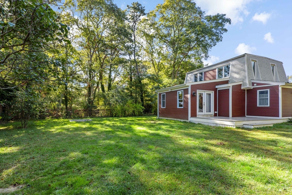10 Briar Patch Lane Mashpee, MA 02649 - Photo 30 of 38 a front view of a house with garden