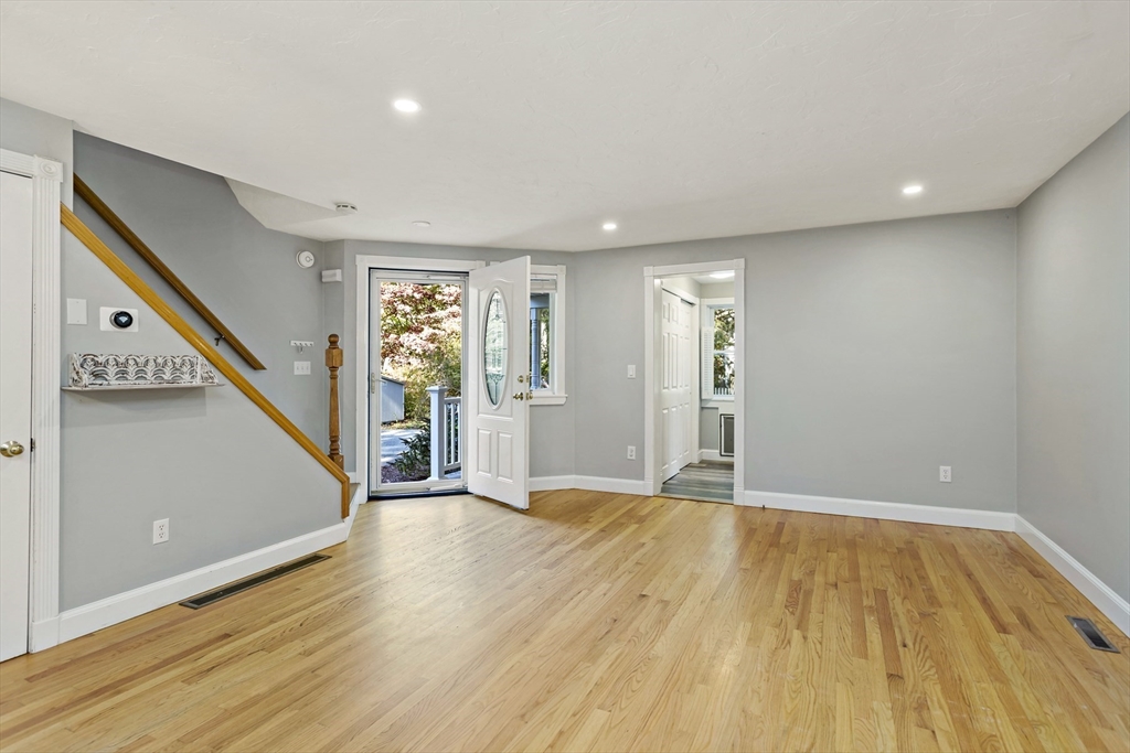 10 Briar Patch Lane Mashpee, MA 02649 - Photo 3 of 38 a view of an empty room with wooden floor and stairs