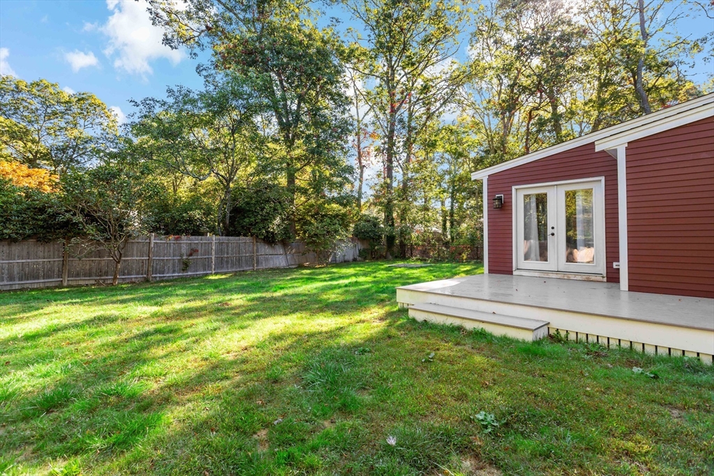 10 Briar Patch Lane Mashpee, MA 02649 - Photo 31 of 38 a view of back yard of the house