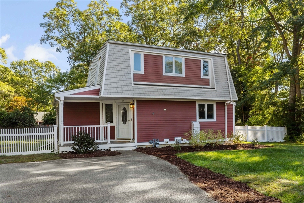 10 Briar Patch Lane Mashpee, MA 02649 - Photo 38 of 38 a front view of a house with a yard and garage