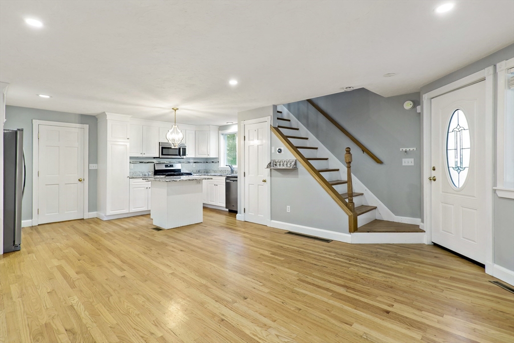 10 Briar Patch Lane Mashpee, MA 02649 - Photo 4 of 38 a view of a kitchen with a sink and a refrigerator