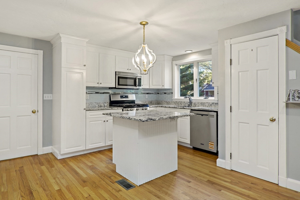 10 Briar Patch Lane Mashpee, MA 02649 - Photo 5 of 38 a kitchen with stainless steel appliances granite countertop a stove a sink and a refrigerator