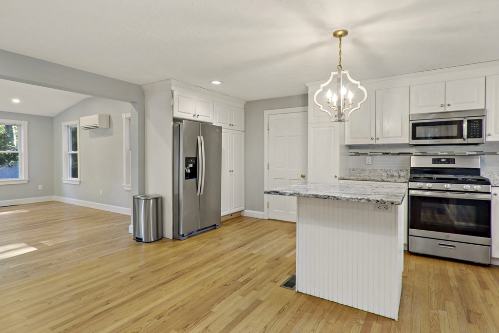 10 Briar Patch Lane Mashpee, MA 02649 - Photo 6 of 38 a kitchen with stainless steel appliances granite countertop a stove refrigerator and microwave