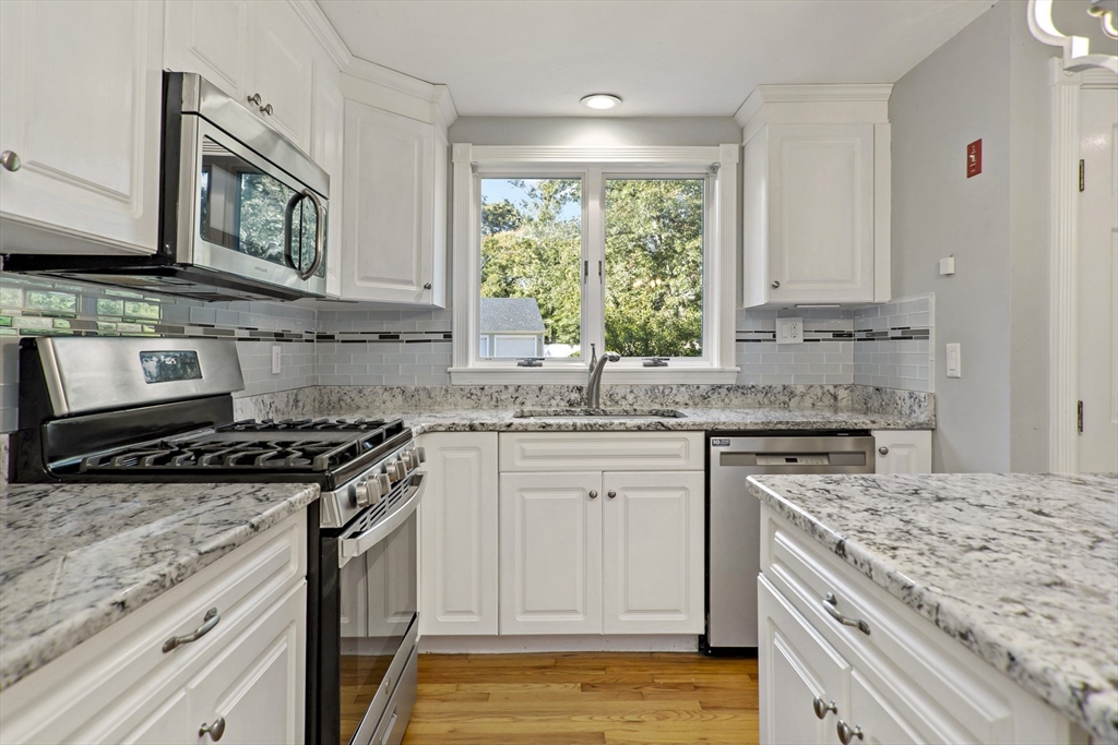 10 Briar Patch Lane Mashpee, MA 02649 - Photo 9 of 38 a kitchen with stainless steel appliances granite countertop a stove sink and cabinets