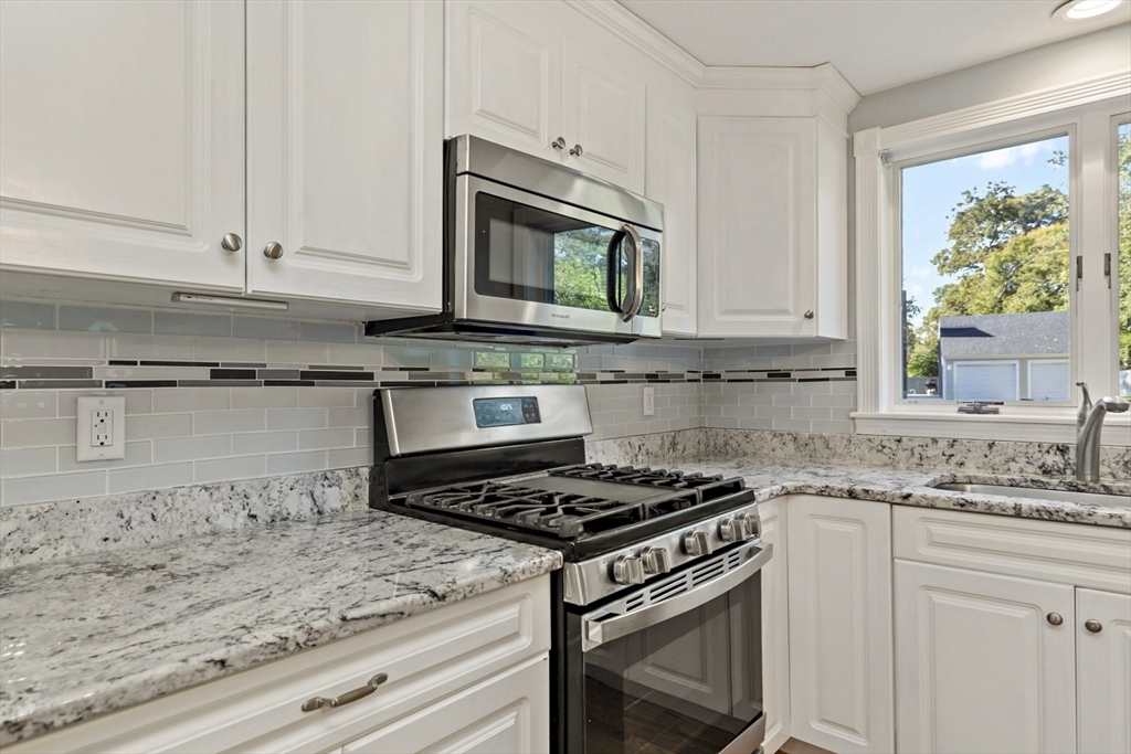 10 Briar Patch Lane Mashpee, MA 02649 - Photo 10 of 38 a kitchen with granite countertop white cabinets and appliances