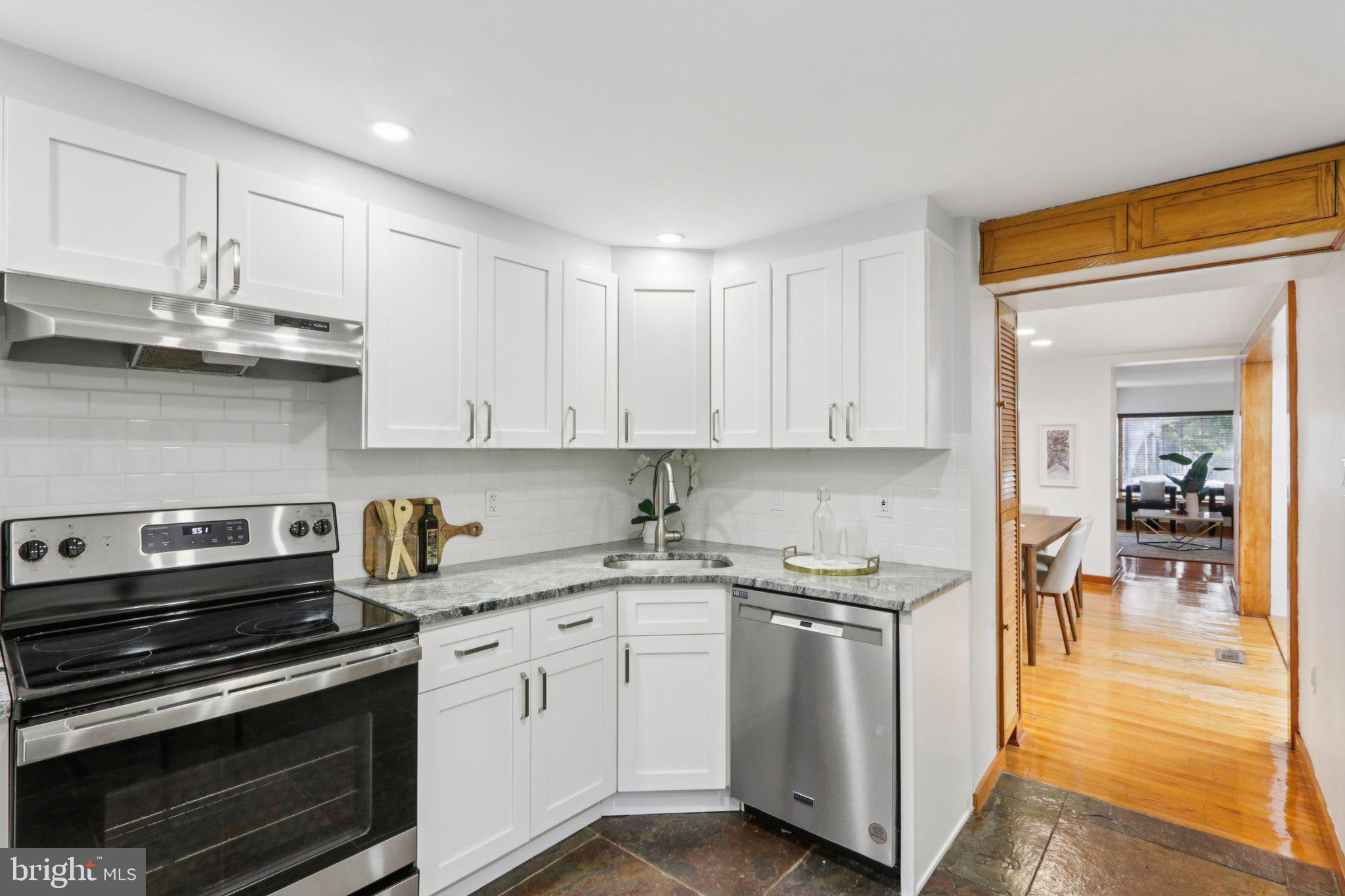 764 South Front Street Philadelphia, PA 19147 - Photo 13 of 46 a kitchen with stainless steel appliances granite countertop a sink and cabinets