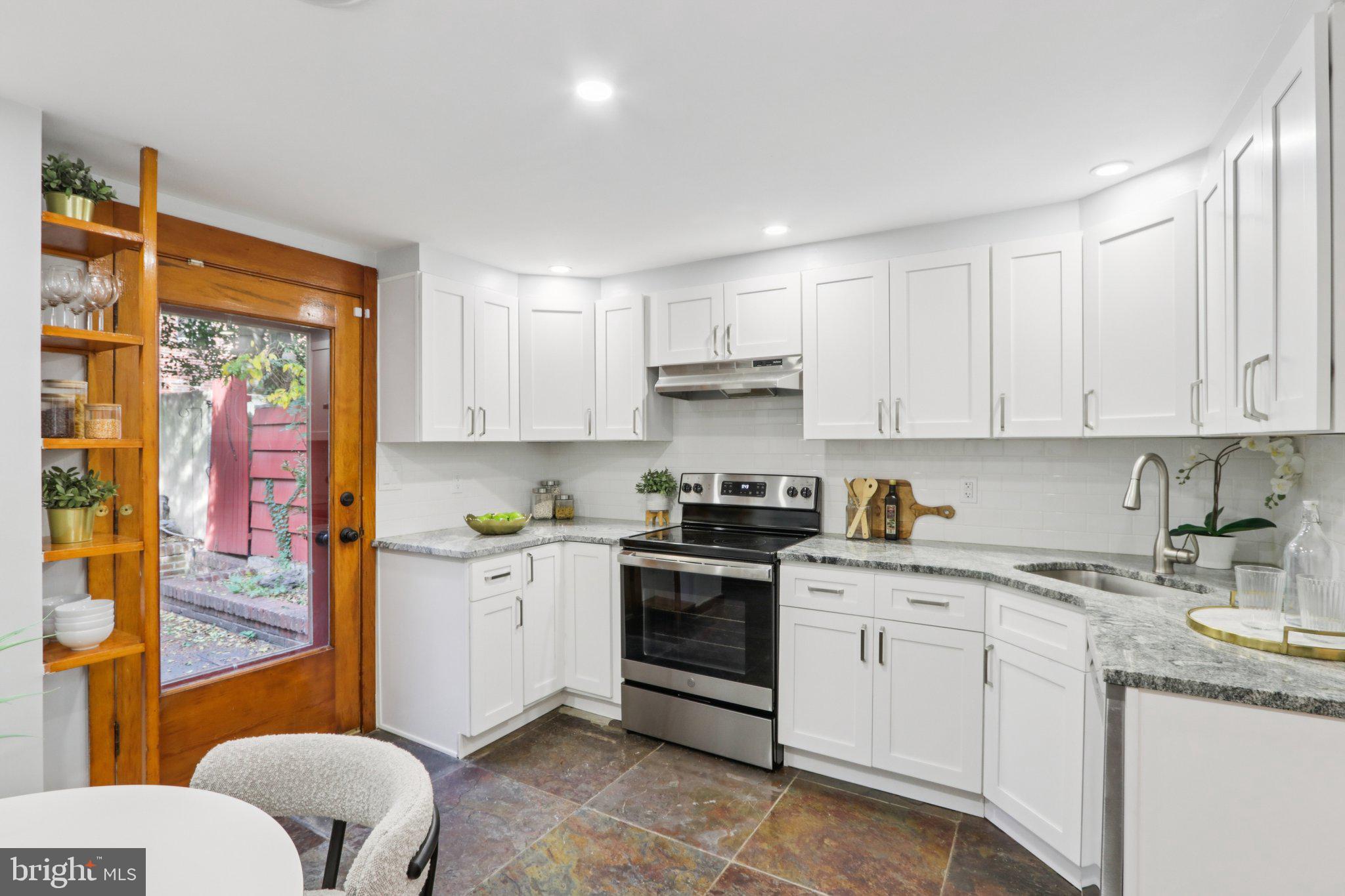 764 South Front Street Philadelphia, PA 19147 - Photo 15 of 46 a kitchen with stainless steel appliances granite countertop a sink and cabinets